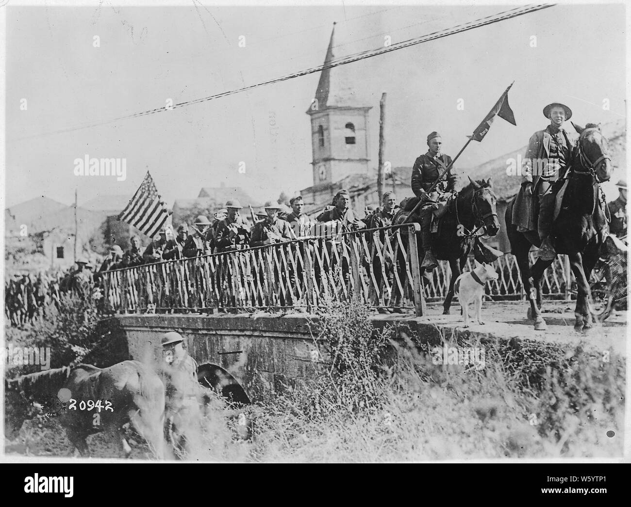 World War I photographs; Scope and content:  Army photographs. Battle of St. Mihiel-American Engineers returning from the front; tank going over the top; group photo of the 129th Machine gun Battalion, 35th Division before leaving for the front; views of headquarters of the 89th Division next to destroyed bridge; Company E, 314th Engineers, 89th Division, and making rolling barbed wire entanglements. Stock Photo