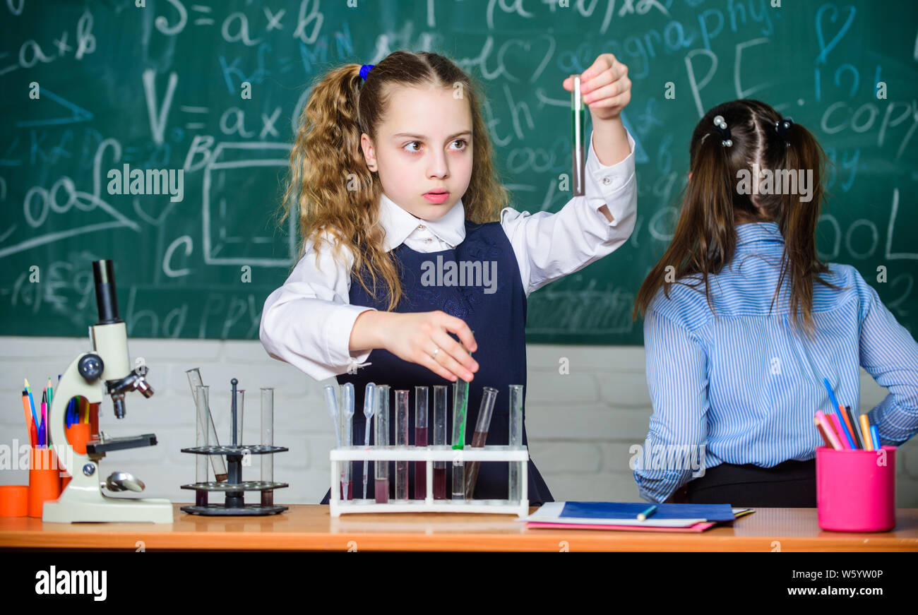 Lab microscope and testing tubes. Chemistry science. Little children. Science. Little kids scientist earning chemistry in school lab. biology experiments with microscope. Oxidants happen. Stock Photo