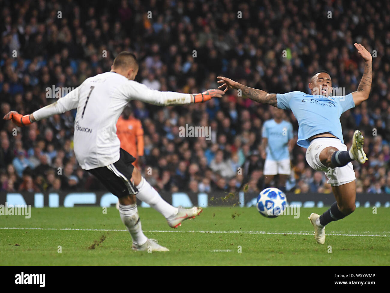 MANCHESTER, ENGLAND - SEPTEMBER 19, 2018: Anthony Lopes of Lyon (L) and Gabriel Jesus of City pictured during the 2018/19 UEFA Champions League Group F game between Manchester City (England) and Olympique Lyonnais (France) at Etihad Stadium. Stock Photo
