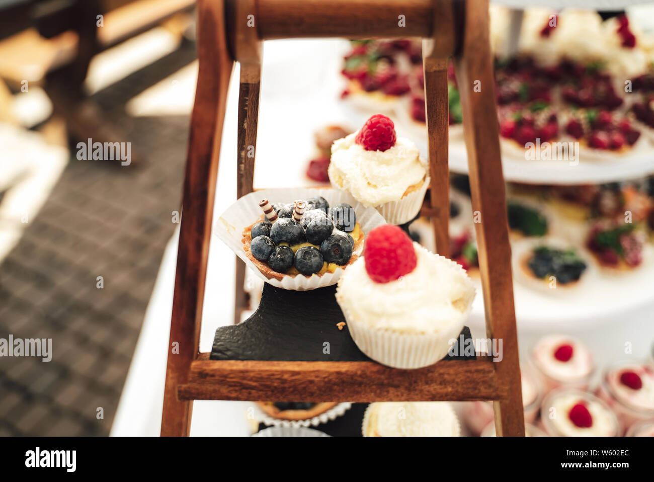 Tasty raspberry muffin with cream on a buffet Stock Photo