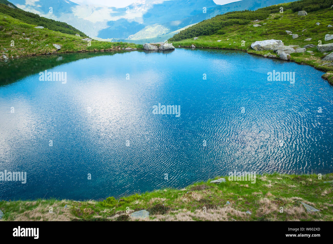 Wind forming beautiful texture on lake surface Stock Photo - Alamy