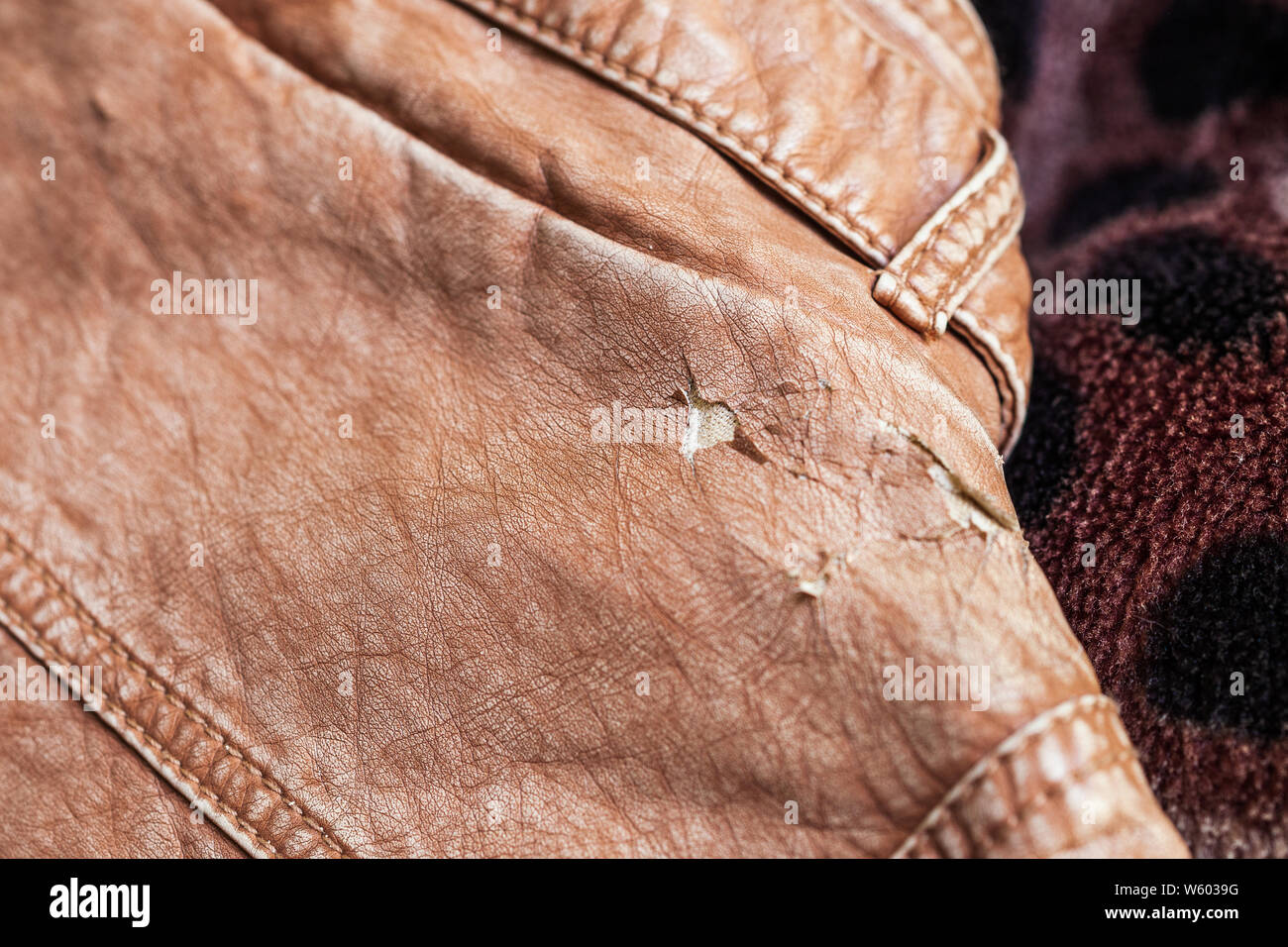 Leather jacket damaged, worn out Stock Photo