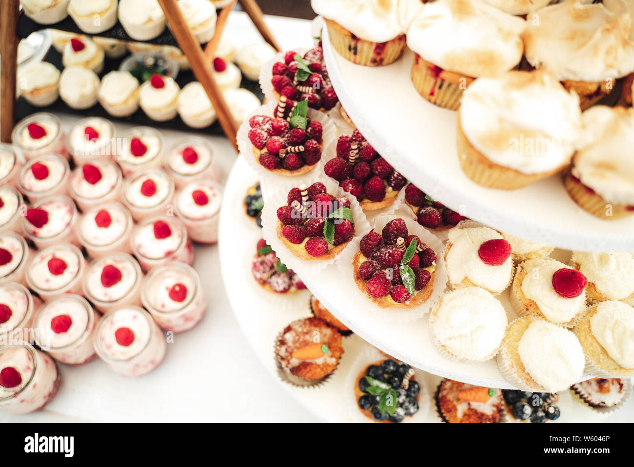 Tiered stand with variety of pastries and desserts Stock Photo - Alamy