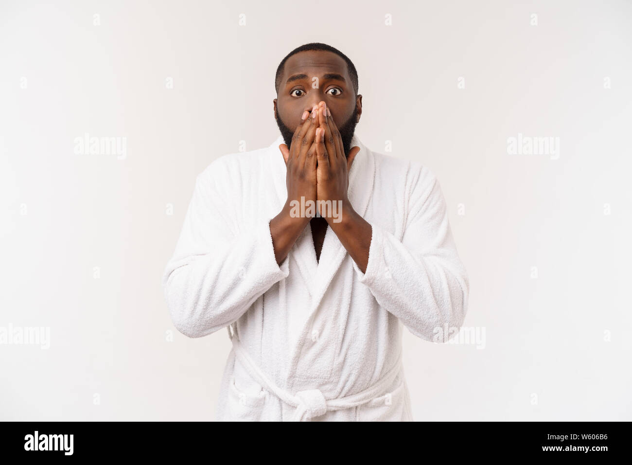 Portrait of excited young African American male screaming in shock and