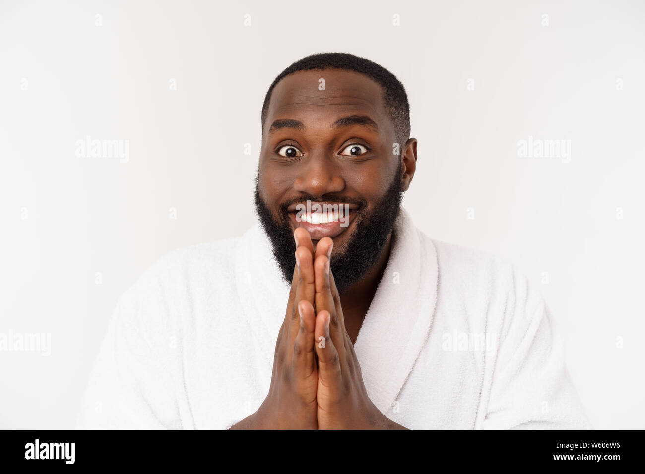 Portrait of excited young African American male screaming in shock and