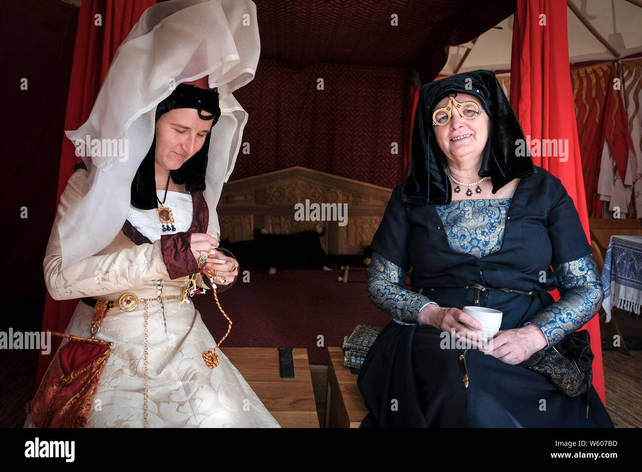 Actors participating in the historical event, recreate the atmosphere of the time inside one of the tents. Stock Photo