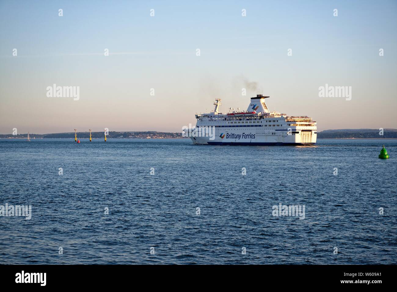The Brittany Ferries passenger and car ferry Bretagne sailing from Portsmouth harbour on a sunny summers evening, Hampshire England UK Stock Photo