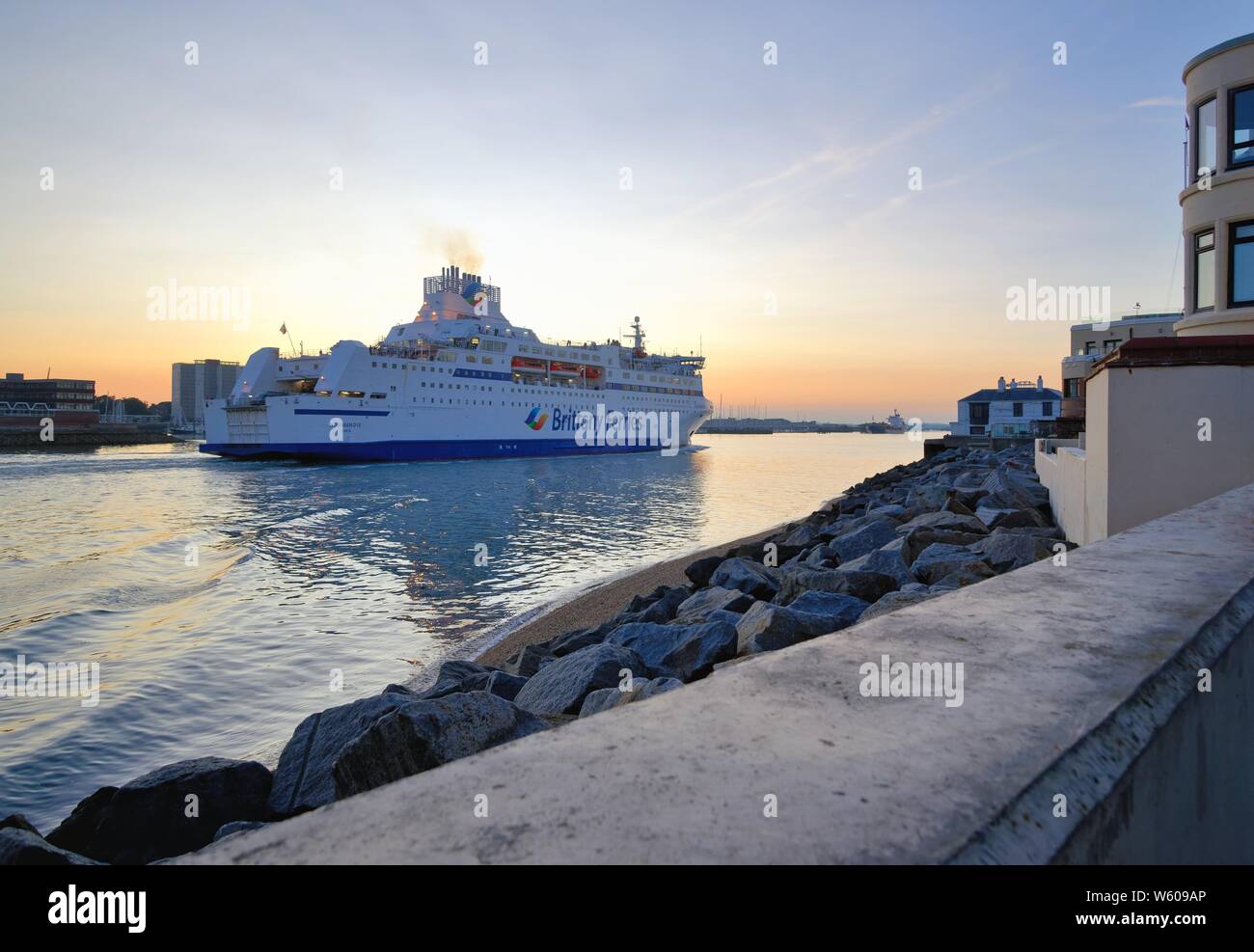 The Brittany Ferries boat Normandie passenger and car ferry sailing into Portsmouth harbour oat dusk, Hampshire England UK Stock Photo
