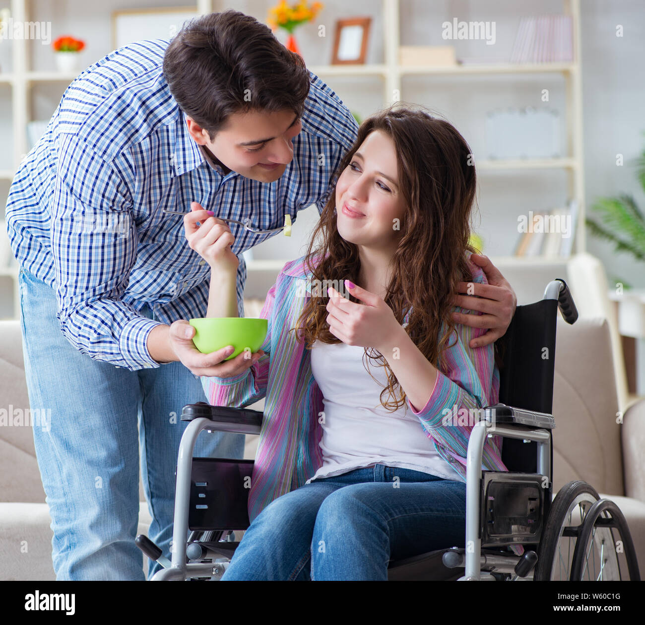 The Young Family Taking Care Of Each Other Stock Photo Alamy