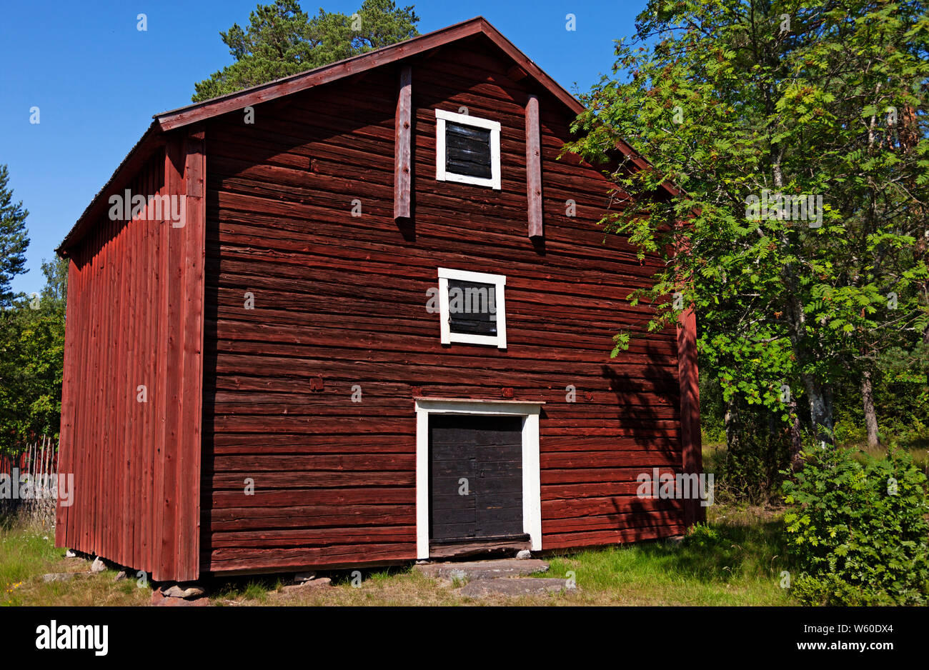 old rural house from Norrland in red, white and black wood Stock Photo