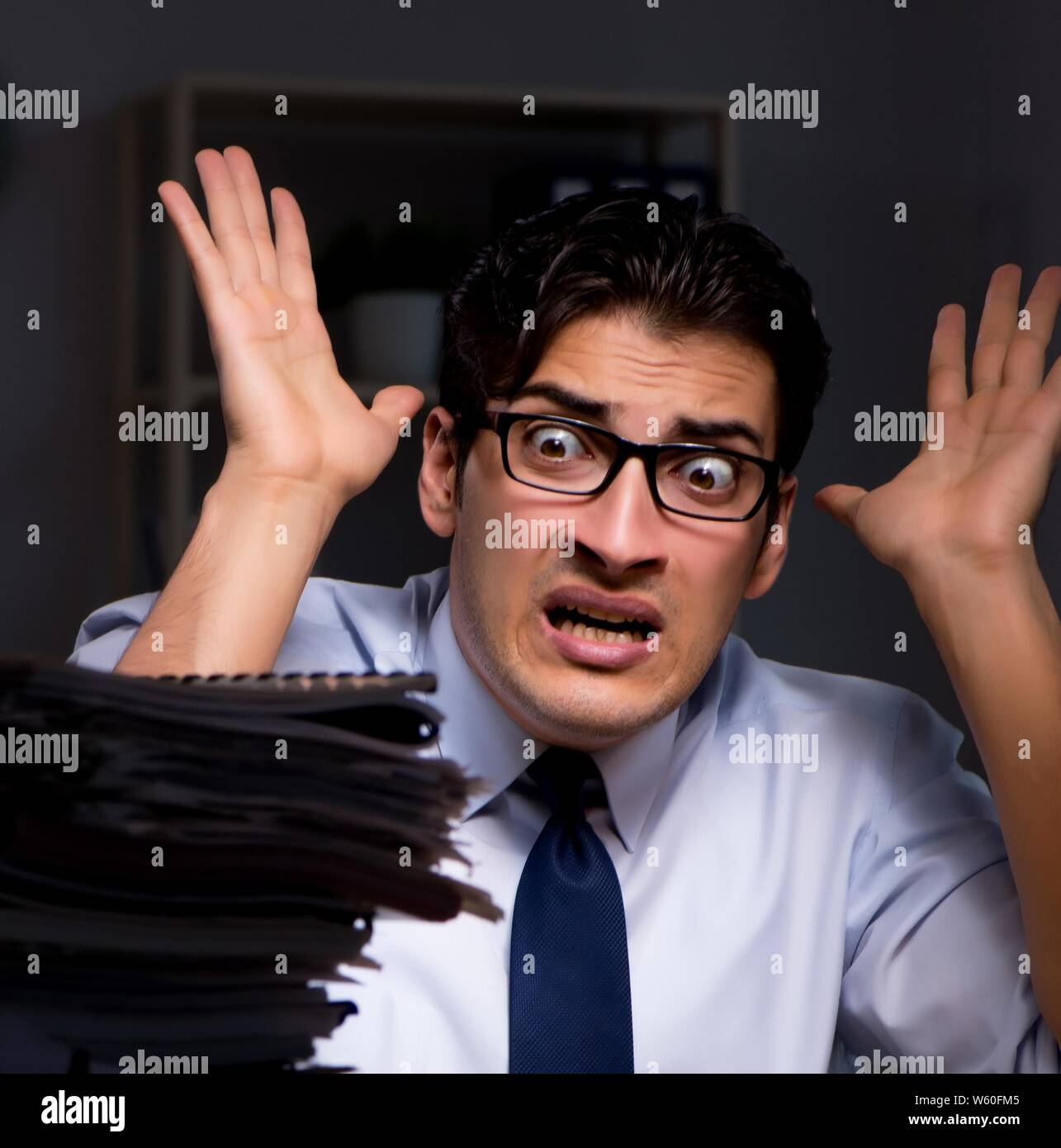 The young businessman working overtime late in office Stock Photo - Alamy