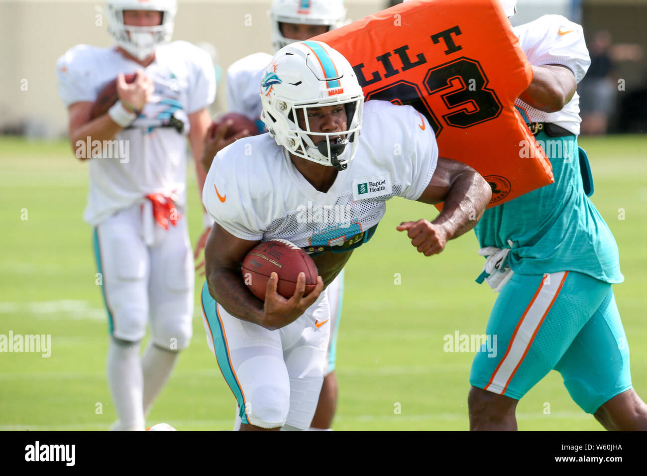 FILE - In this Sept. 8, 2019, file photo, Miami Dolphins running back Mark  Walton (22) warms up before an NFL football game against the Baltimore  Ravens, in Miami Gardens, Fla. The