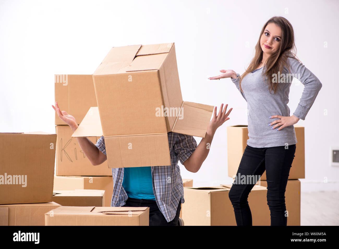 The young pair moving to new flat Stock Photo - Alamy