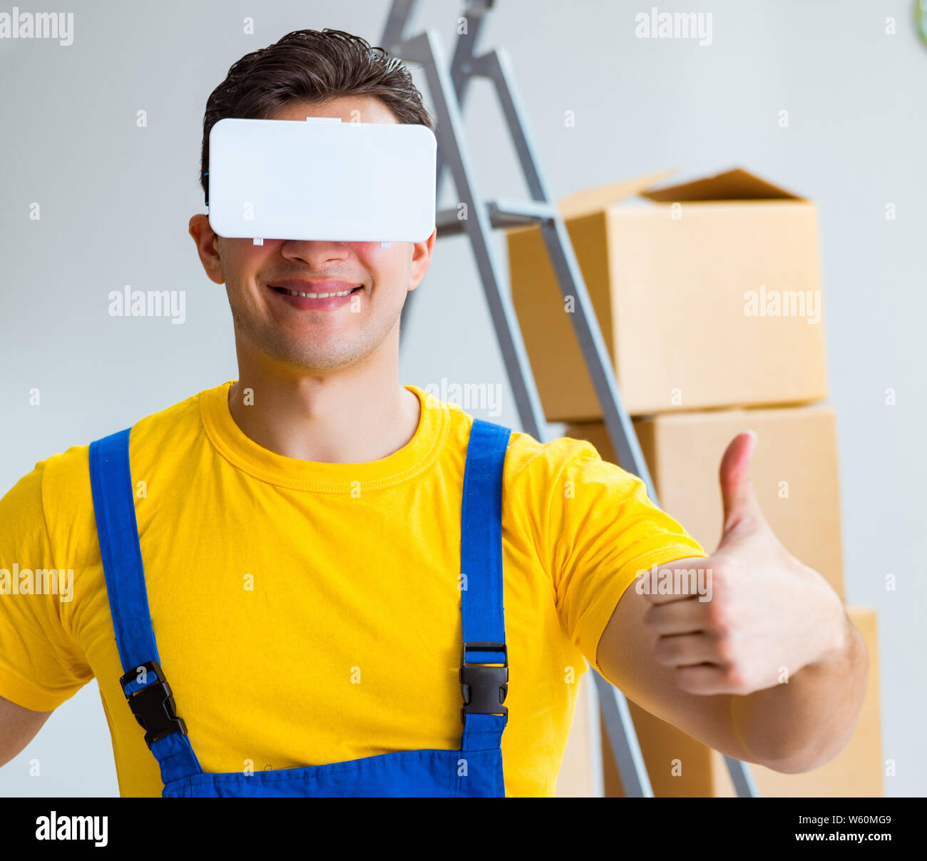 The painter contractor working with virtual reality goggles Stock Photo