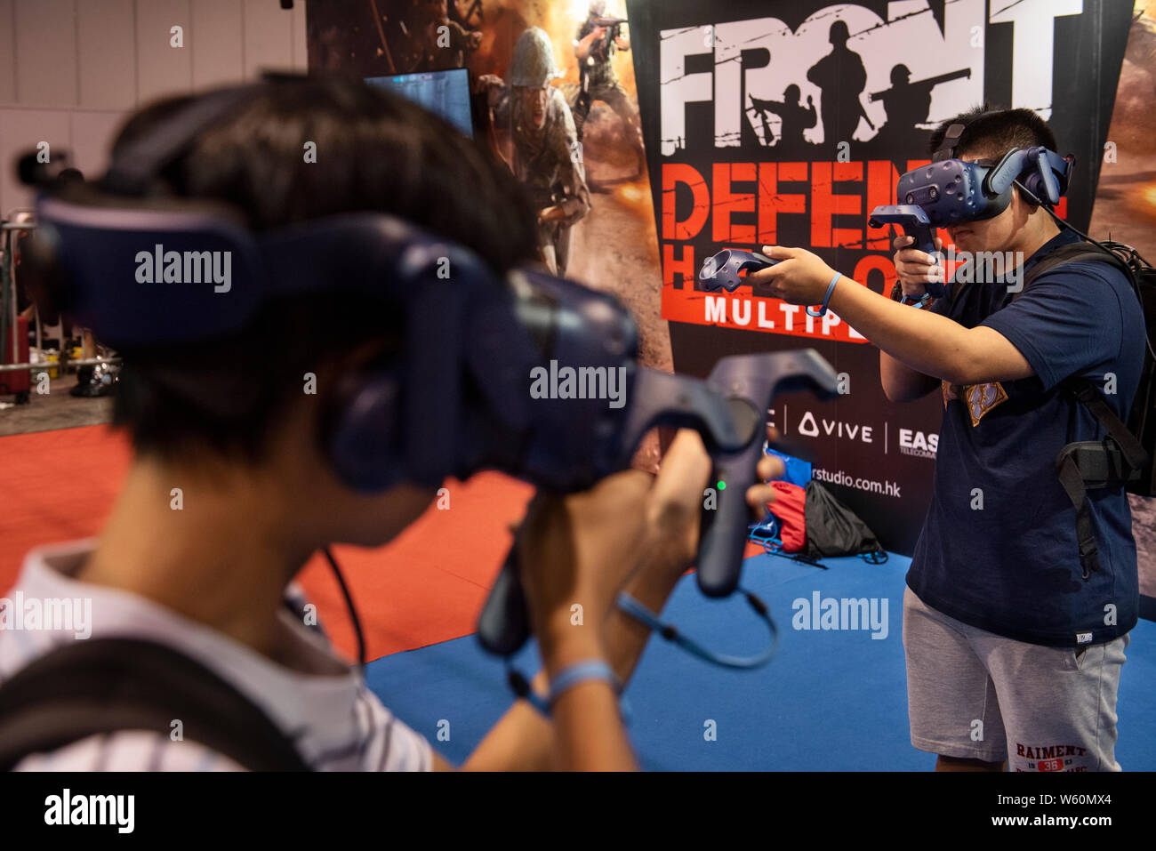 Visitors play with a Virtual Reality VR set during the ESports and