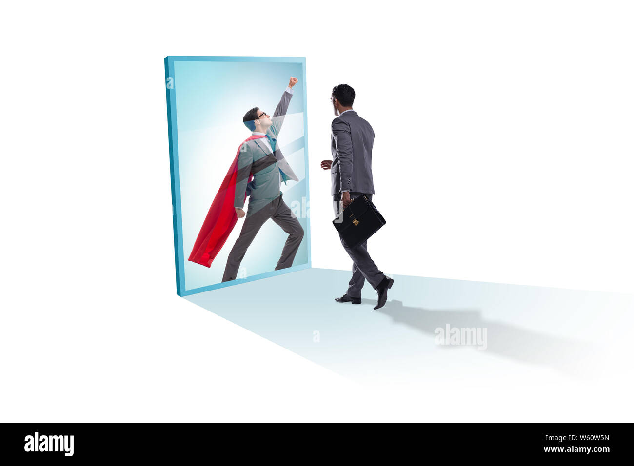 The businessman seeing himself in mirror as superhero Stock Photo - Alamy