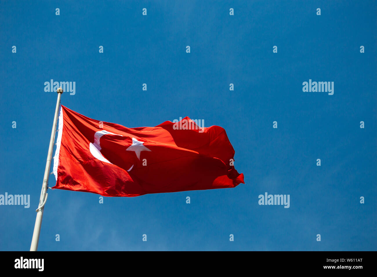 Turkish national flag with white star and moon in sky Stock Photo - Alamy