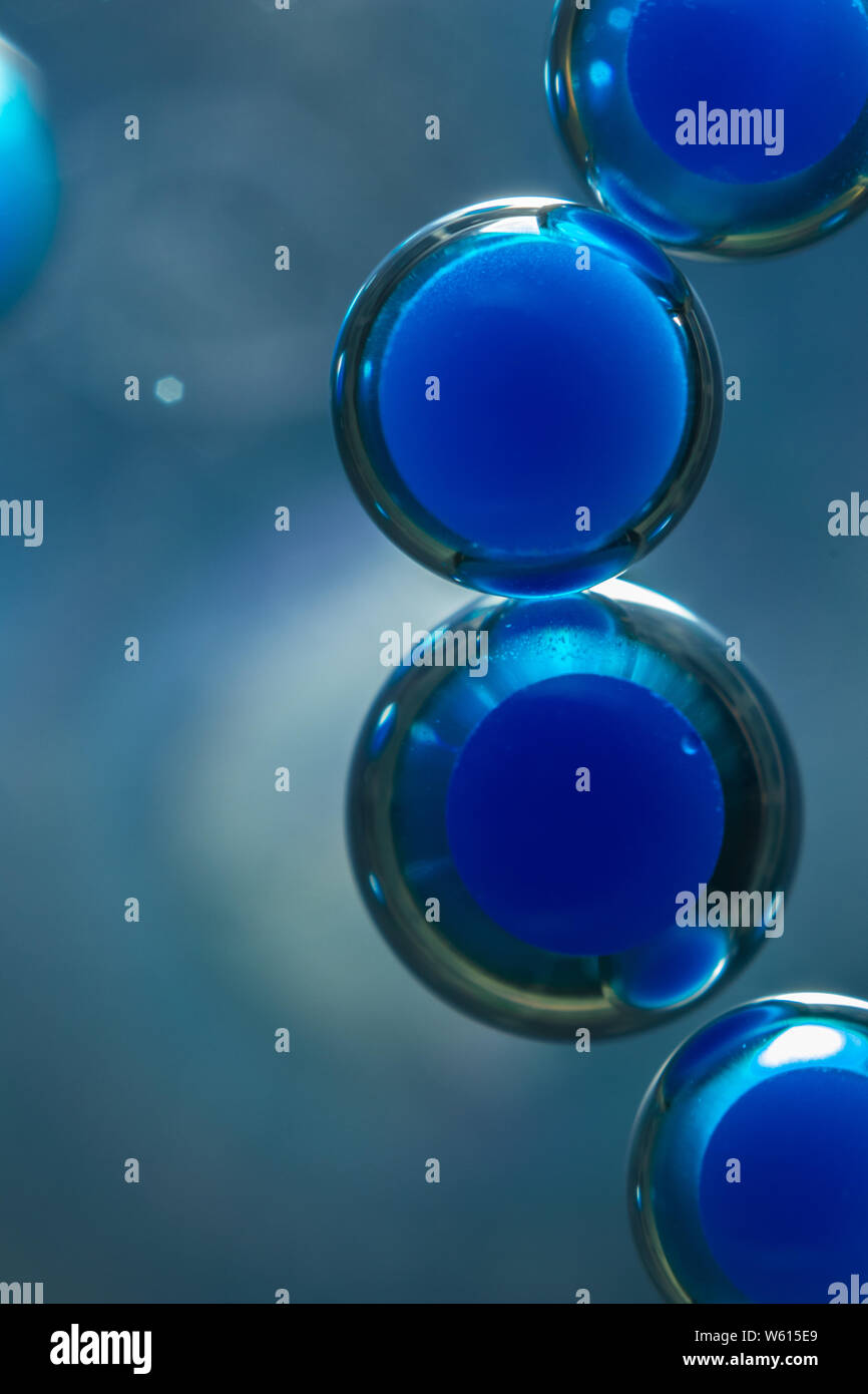 Water bubbles in oil with food coloring, for diverse backgrounds and