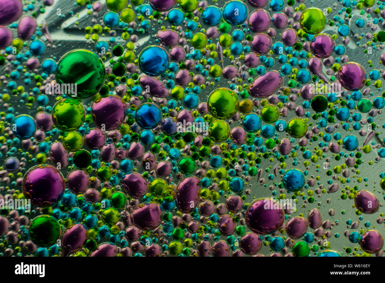 Water bubbles in oil with food coloring, for diverse backgrounds and applications Stock Photo