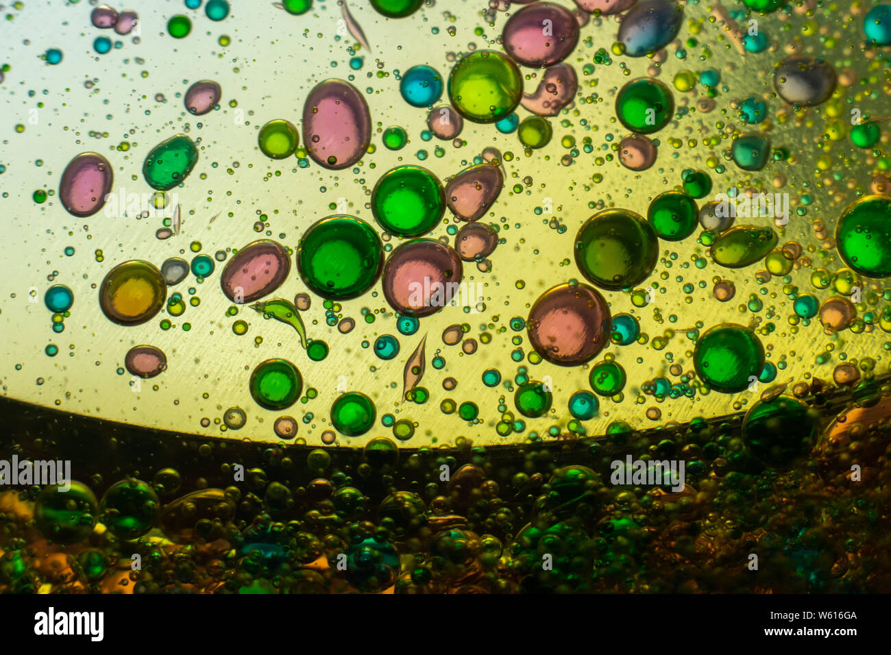 Water bubbles in oil with food coloring, for diverse backgrounds and applications Stock Photo