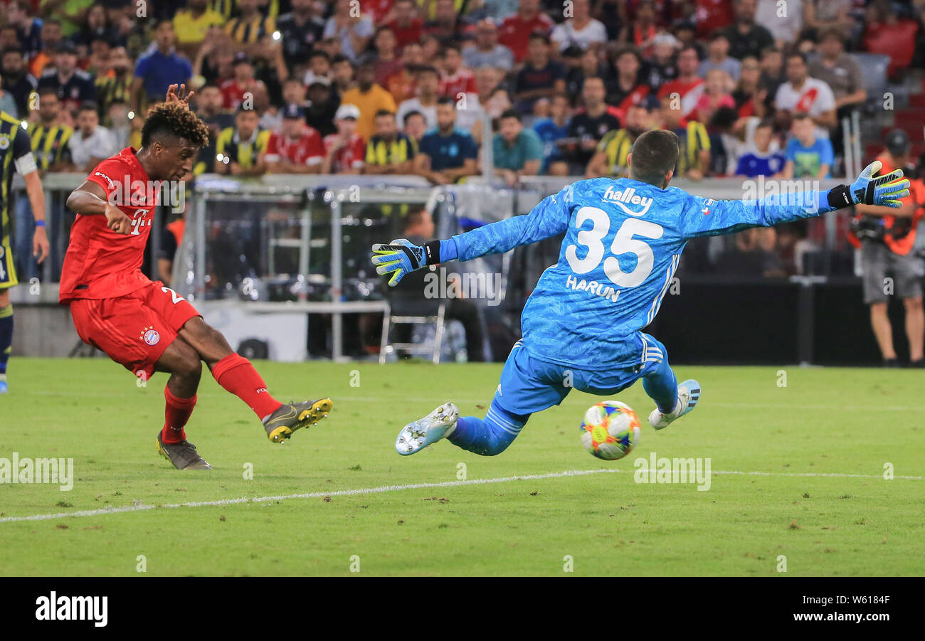 (190731) -- MUNICH, July 31, 2019 (Xinhua) -- Kingsley Coman (L) of Bayern Munich shoots and scores during a Audi Cup semifinal match against Fenerbahce SK of Turkey in Munich, Germany, on July 30, 2019. Bayern Munich won 6-1. (Photo by Philippe Ruiz/Xinhua) Stock Photo