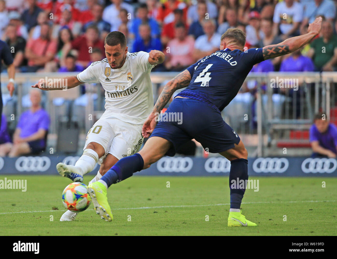 (190731) -- MUNICH, July 31, 2019 (Xinhua) -- Eden Hazard (L) of Real Madrid takes a shot under the defense from Toby Alderweireld of Tottenham Hotspur during their Audi Cup semifinal match in Munich, Germany, on July 30, 2019. Real Madrid lost 0-1. (Photo by Philippe Ruiz/Xinhua) Stock Photo