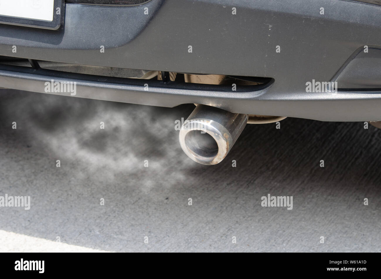 Car exhaust while leaving a smoke Stock Photo Alamy