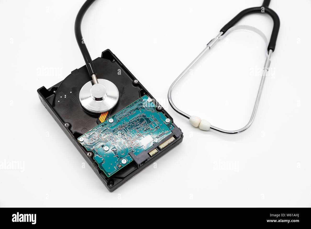 stethoscope with hard disk isolated and white background (this image for technology security checkup concept) Stock Photo