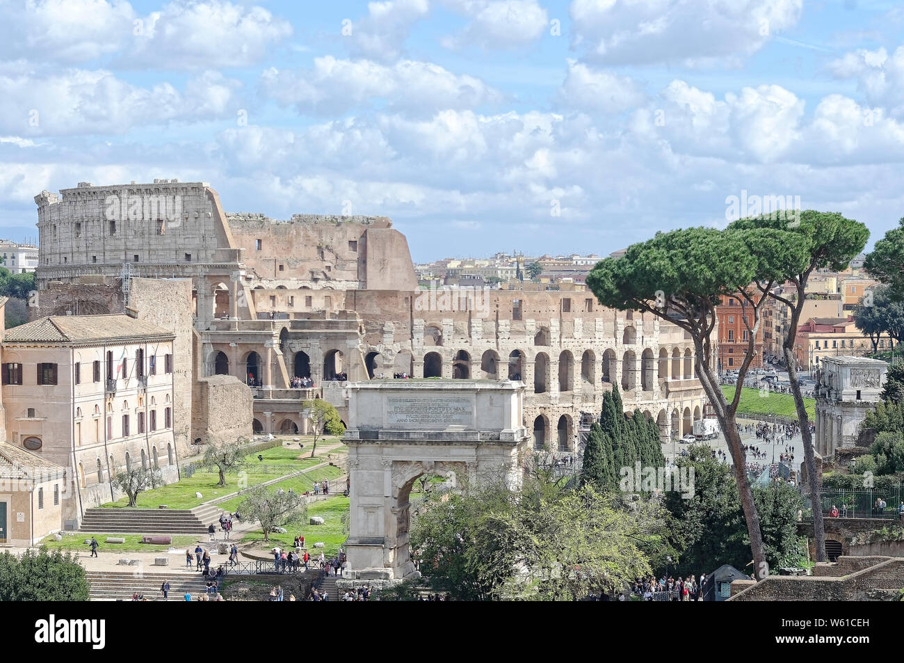 A view of Coliseum of Roman from Palatine hell. A front view of Arch of Constantine is distinguish. At the right,a view of Arch of Tito is also clear. Stock Photo