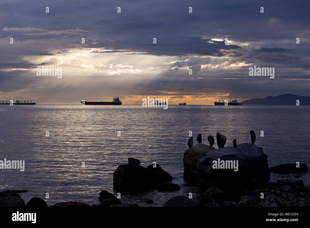 Beautiful shot of the sea with balanced rocks on the rock near the ...