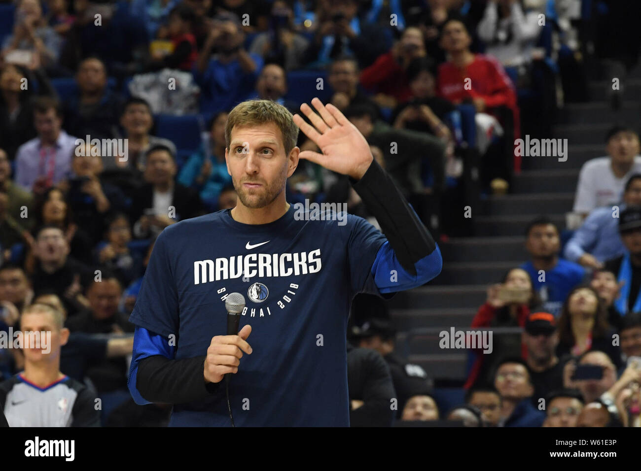 Dirk Nowitzki of Dallas Mavericks waves to spectators before the Shanghai match of the NBA China Games between Dallas Mavericks and Philadelphia 76ers Stock Photo