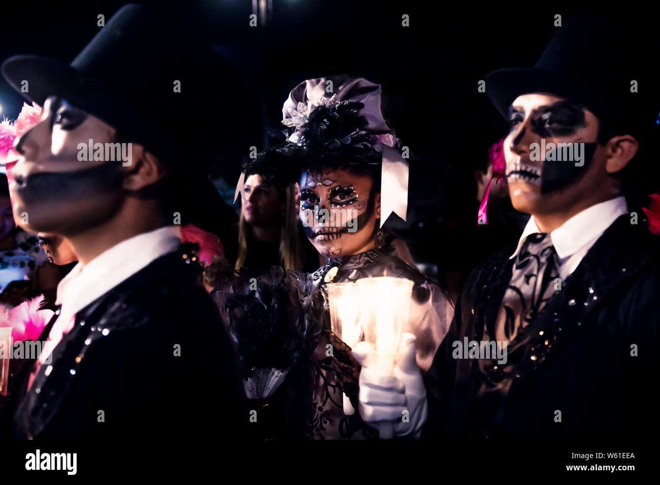Merida, Mexico - 27 October 2019: Parade with costumed caterinas and costumed men for dia de los muertos at Remate de Paseo Montejo Stock Photo