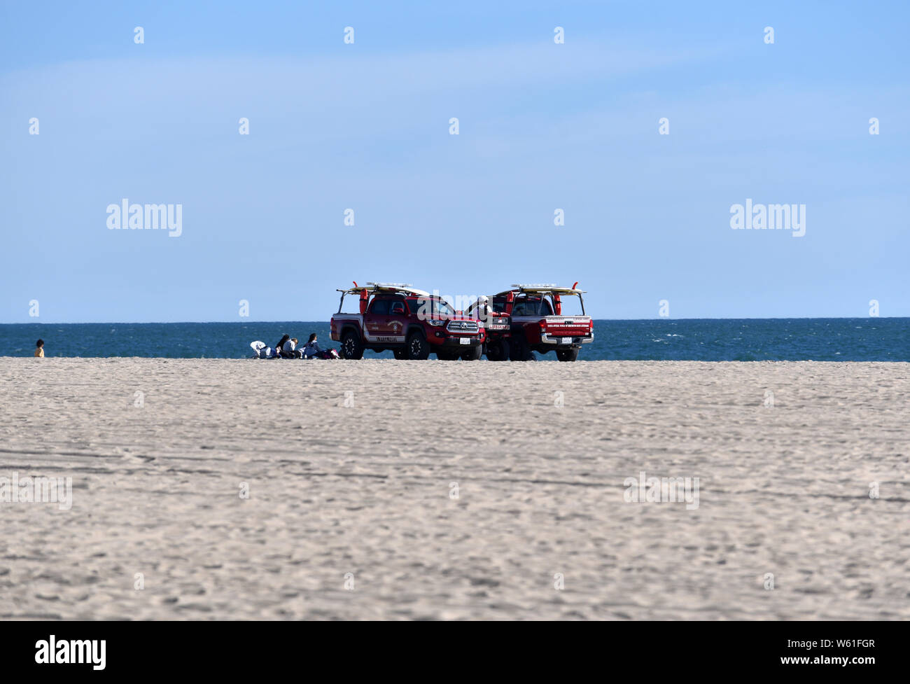 HUNTINGTON BEACH, CA/USA - MARCH 14, 2019: Lifeguard patrol on the beach on a sunny day Stock Photo