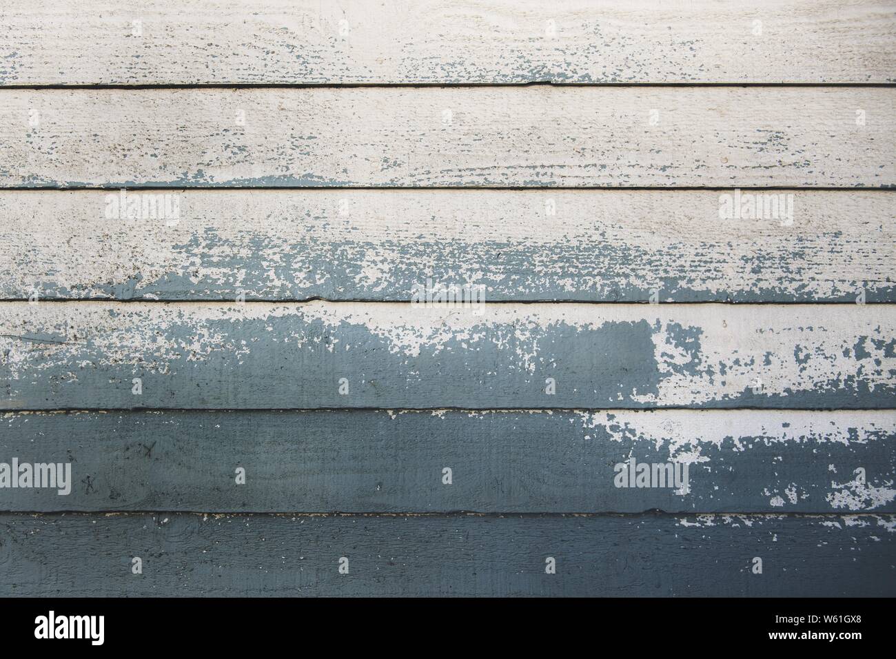 Closeup shot of half-painted wooden planks Stock Photo