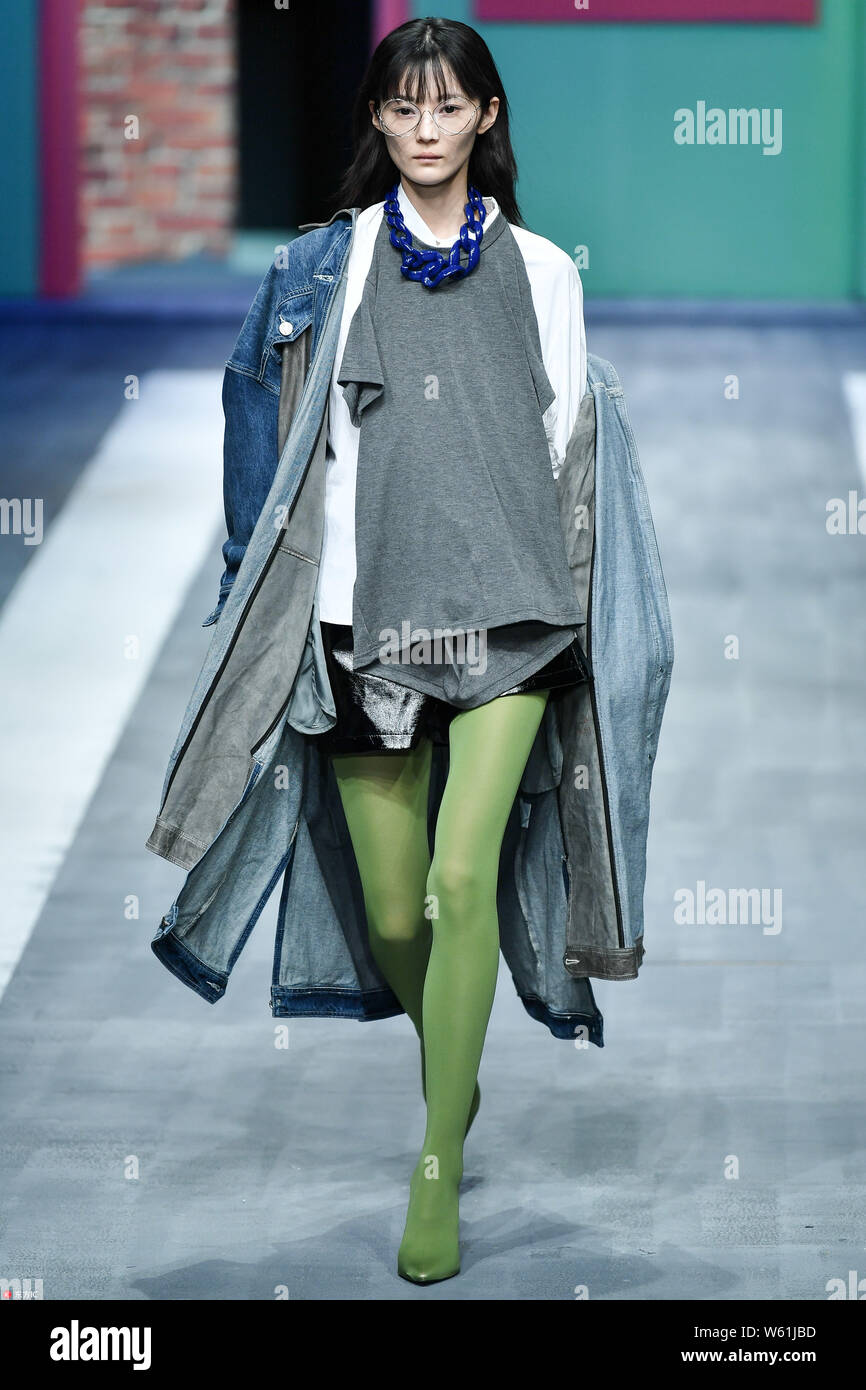 A model displays a new creation at the fashion show of HONGWEI S by Shi ...
