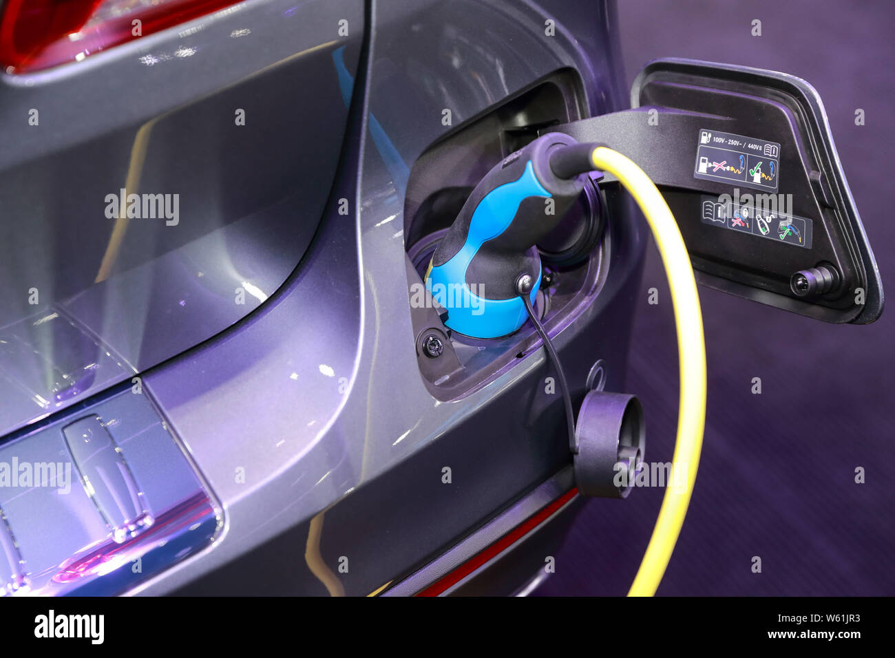 Modern car charging electric Stock Photo - Alamy