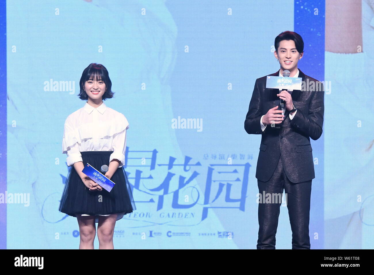 Chinese actor Dylan Wang Hedi, right, of the new lineup of Chinese boy  group F4 and actress Shen Yue attend a press conference for the broadcast  of th Stock Photo - Alamy