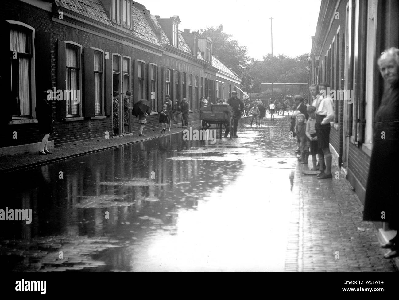 Netherlands history - street scene in a city in the Netherlands after a rain ca. 1930 Stock Photo