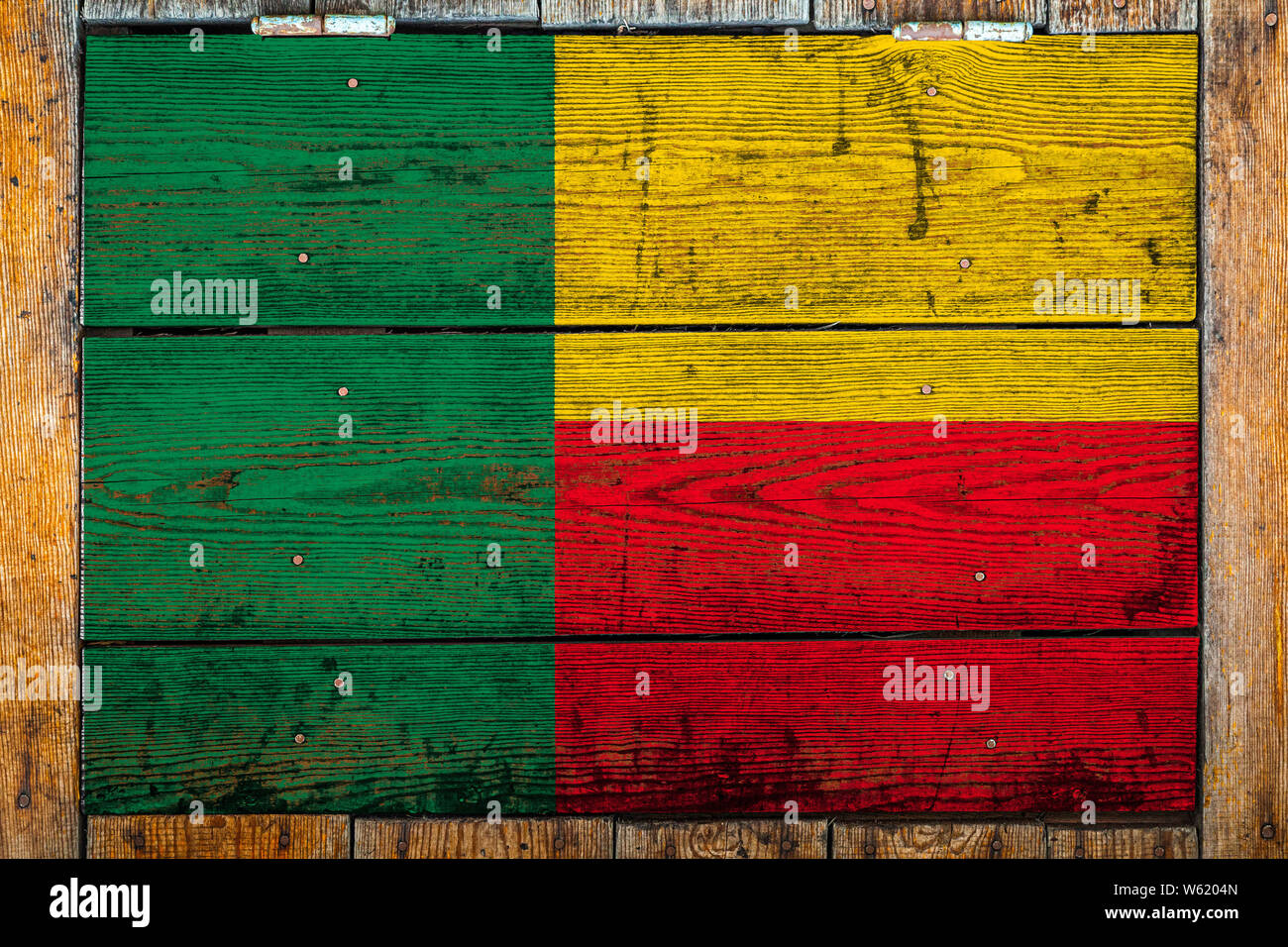 National flag of Benin on a wooden wall background.The concept of ...