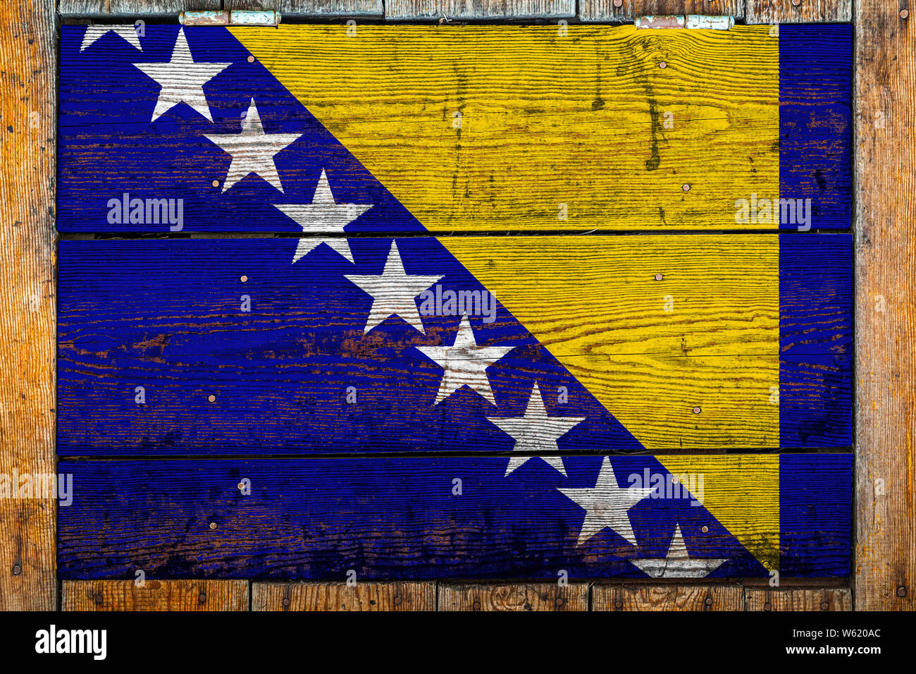 National flag of Bosnia Herzegovina on a wooden wall background.The ...
