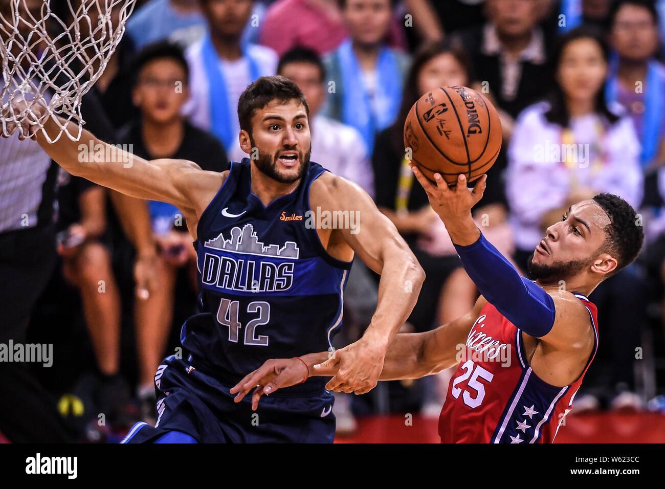 Maxi Kleber of Dallas Mavericks, left, challenges Ben Simmons of  Philadelphia 76ers during the Shenzhen match of the NBA China Games in  Shenzhen city Stock Photo - Alamy