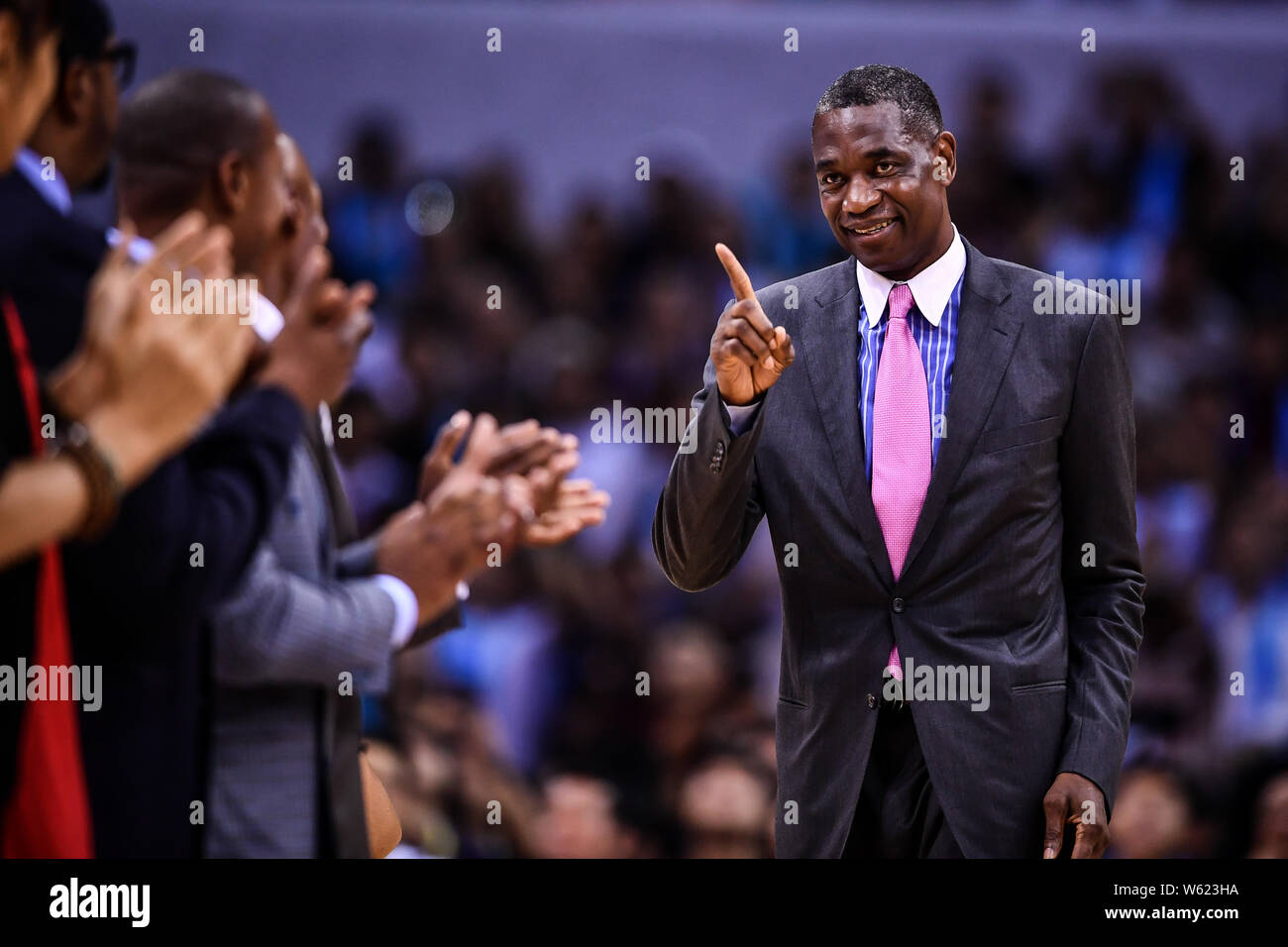 Retired NBA star Dikembe Mutombo arrives for the Shenzhen match of the NBA China Games between Dallas Mavericks and Philadelphia 76ers in Shenzhen cit Stock Photo