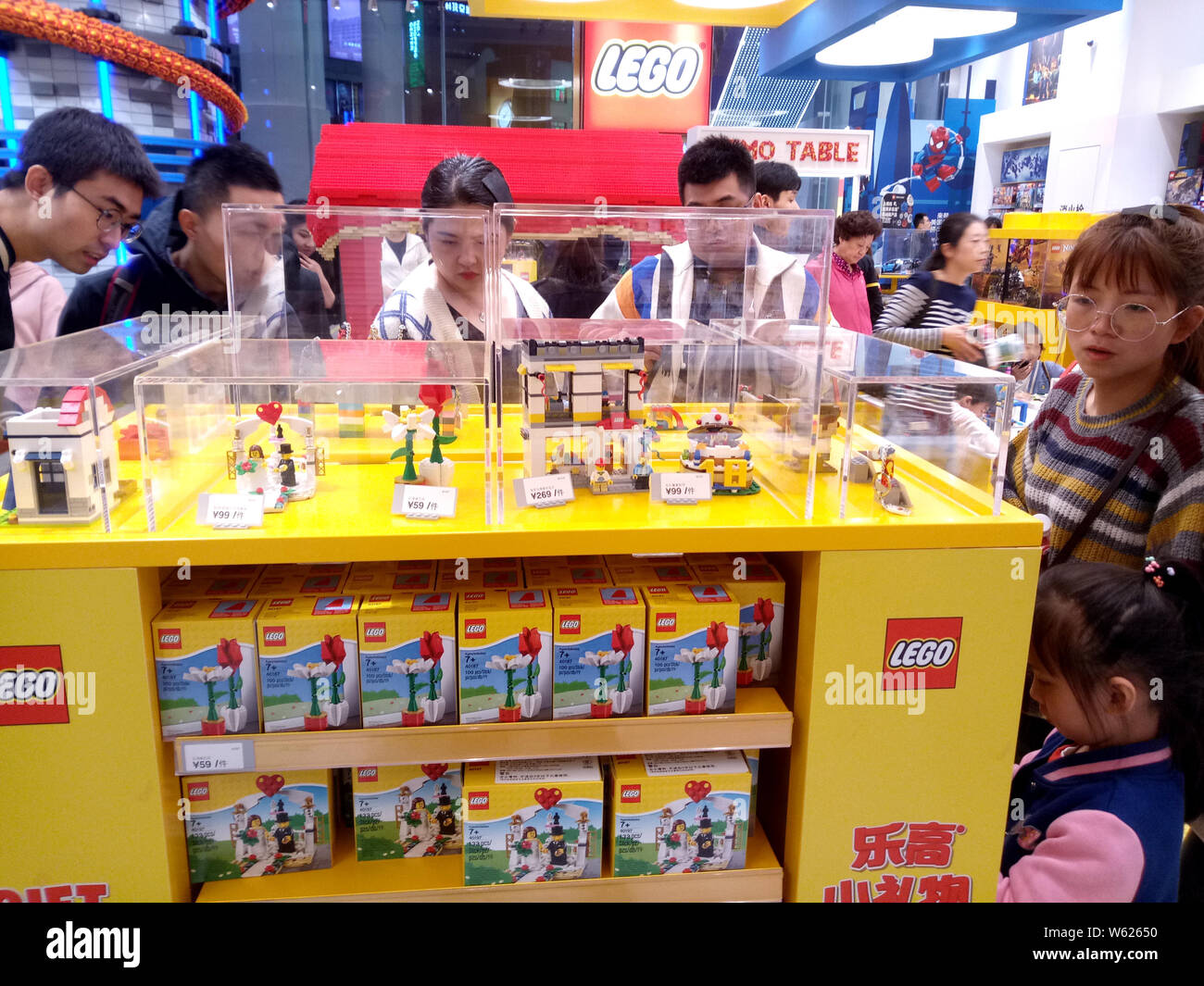 People visit the Lego Flagship store at Shanghai ShiMao Festival City ...
