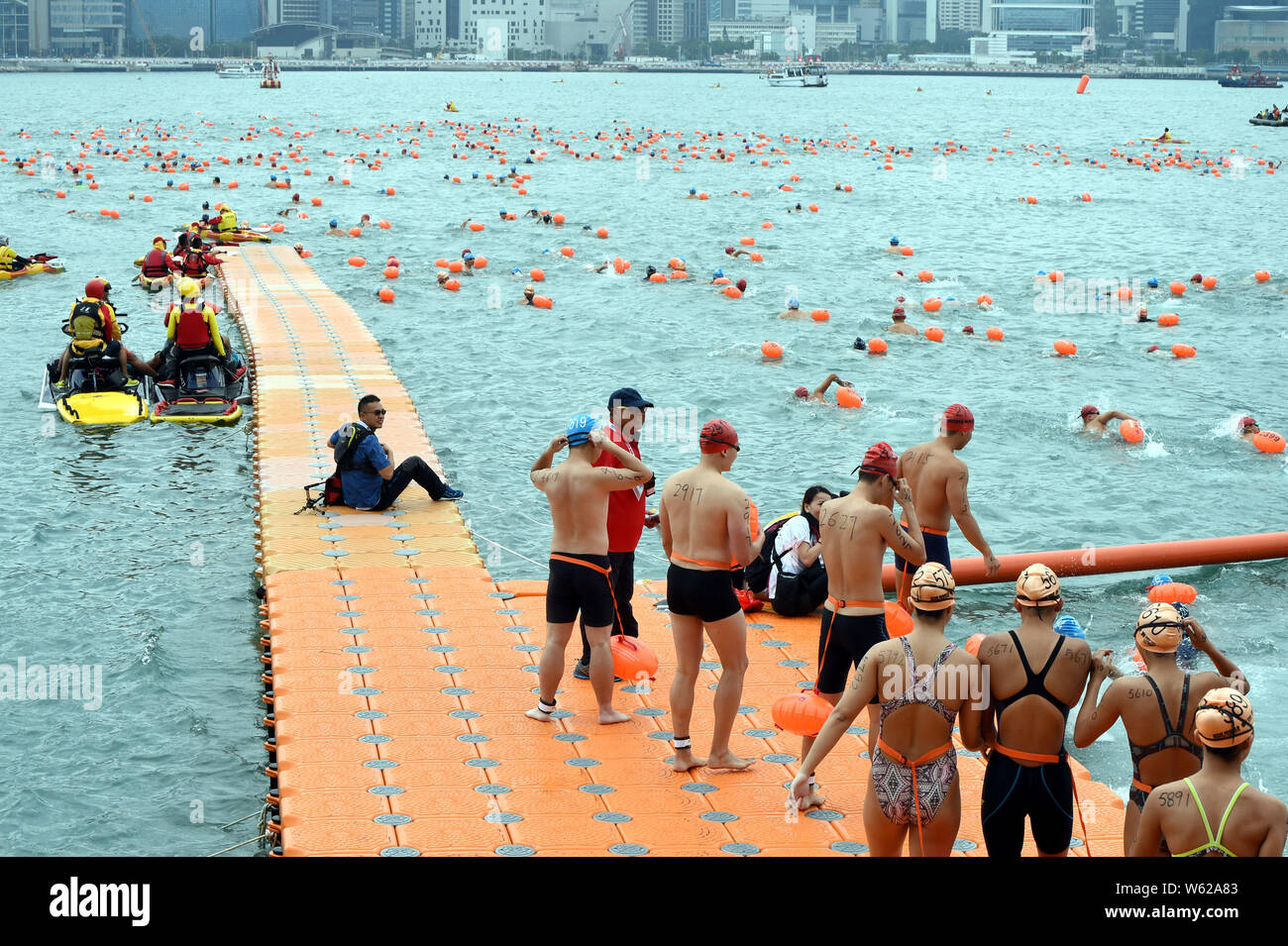 Thousands of swimmers take part in the annual CrossHarbour swim in