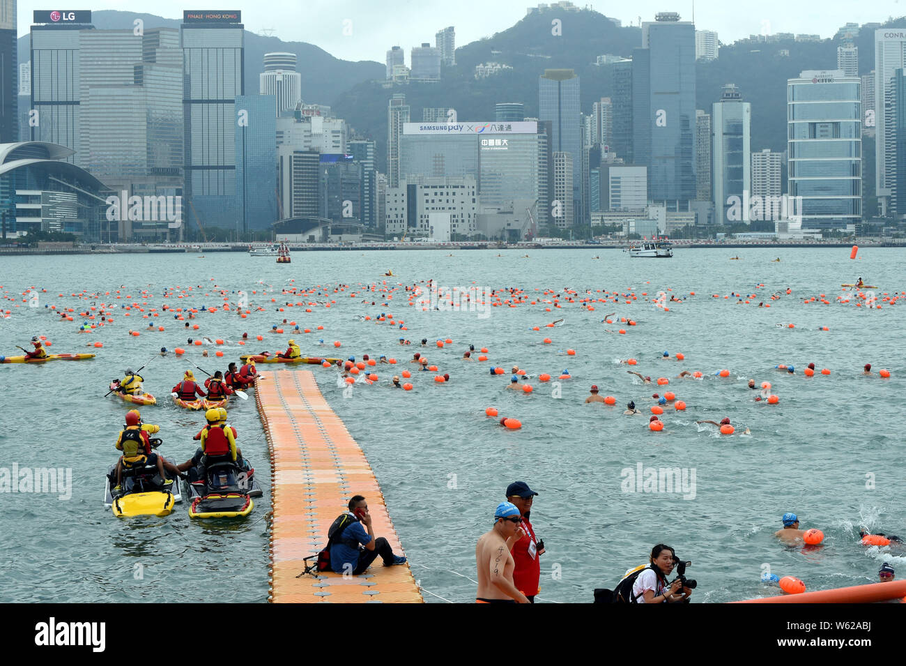 Thousands of swimmers take part in the annual CrossHarbour swim in