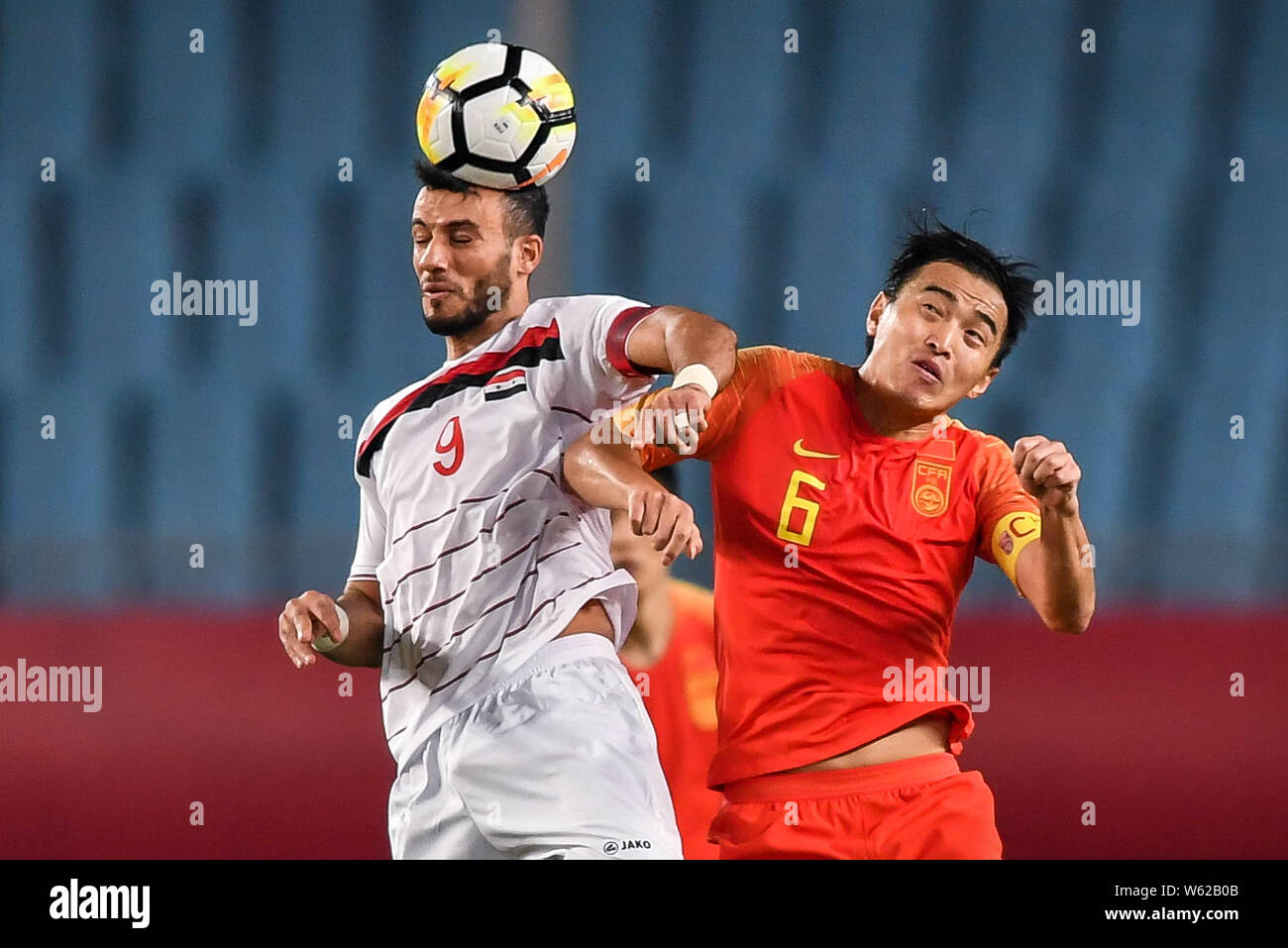 Omar Al Soma, left, of Syria national men's football team heads the ball  against Feng Xiaoting of Chinese national men's football team in the CFA  Team Stock Photo - Alamy