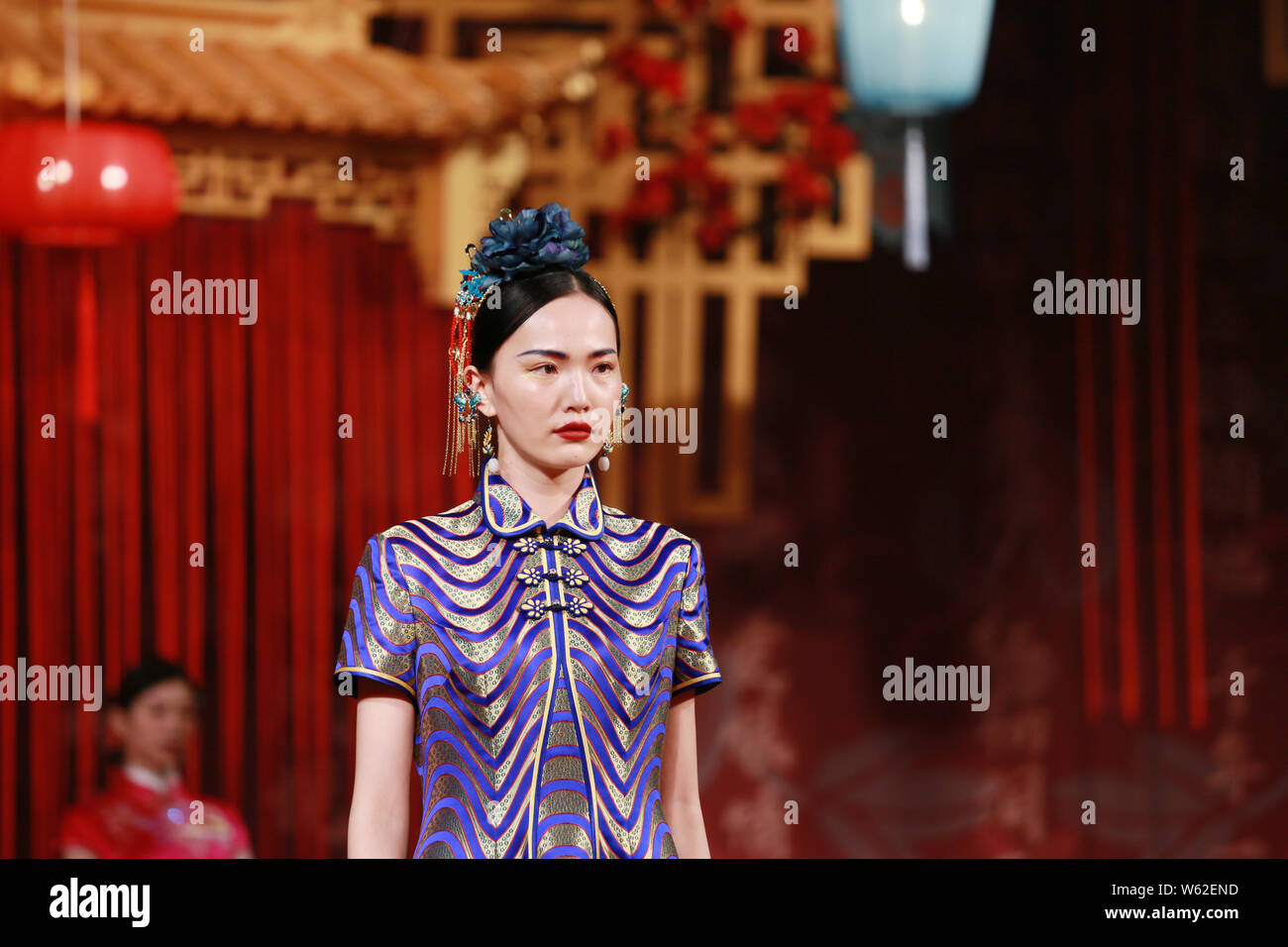 A Model Displays A Traditional Chinese Wedding Dress At The Story