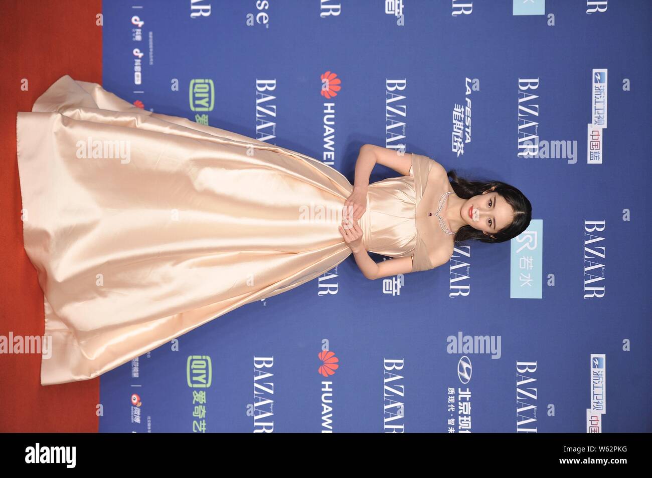 Chinese actress Yang Mi arrives on the red carpet for the 2018 Bazaar Star Charity Night Gala in Beijing, China, 12 October 2018.   Dress: Reem Acra Stock Photo
