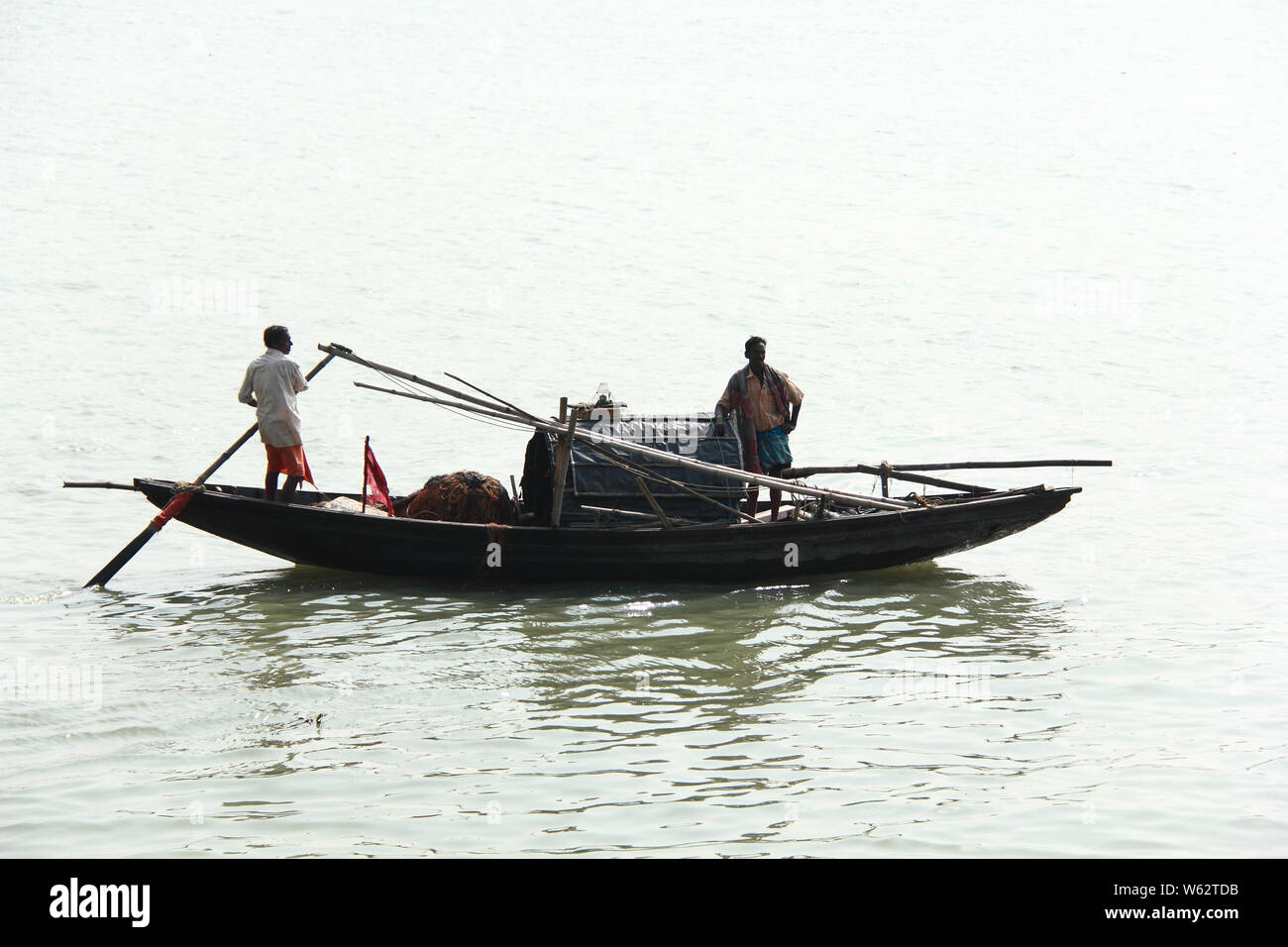 Man standing in rowboat and fishing hi-res stock photography and images ...