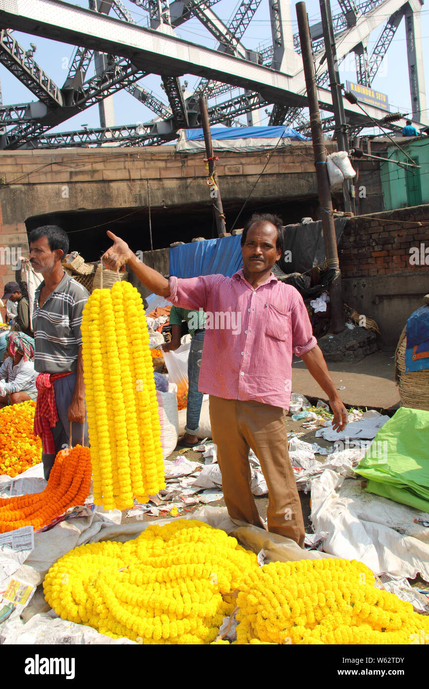 Flower sellers selling garlands at the flower market, Howrah Bridge